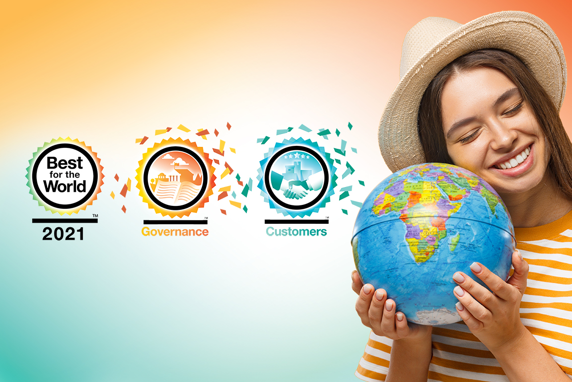 Young ACU member holding a globe celebrating best for the world recognition